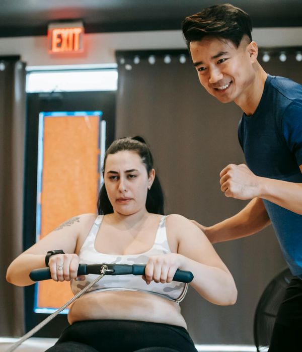 Man performing a functional strength exercise with determination.